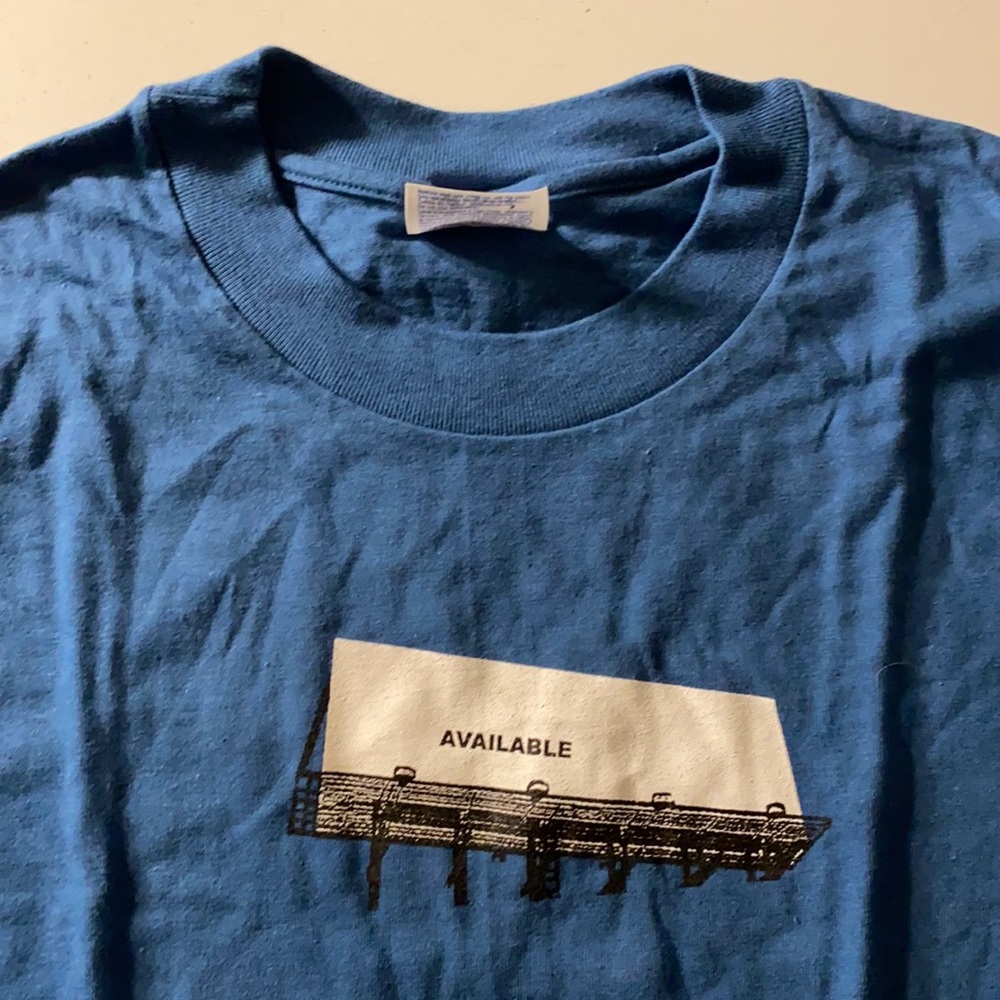 Funny T-shirt with “Available” billboard print